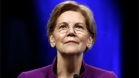 Reuters Senator Elizabeth Warren at a podium