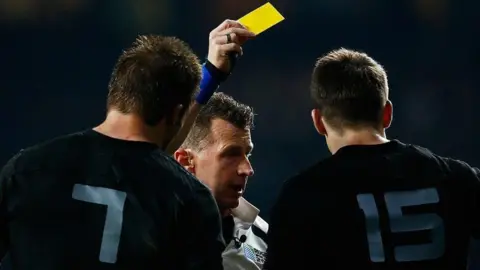 Getty Images Nigel shows the yellow card to Ben Smith of New Zealand during the 2015 Rugby World Cup final