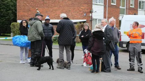 South Beds News Agency People at scene of sinkhole outside Cedar Court, St Albans