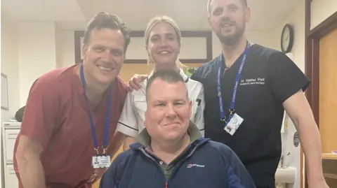 BBC Cancer patient Daniel Kilty with surgeons.