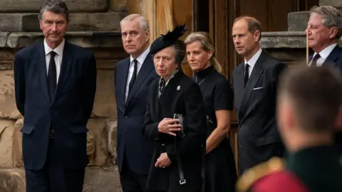 PA Media Vice Admiral Timothy Laurence, the Duke of York, the Princess Royal, the Countess of Wessex and the Earl of Wessex watch as the coffin of Queen Elizabeth II, draped with the Royal Standard of Scotland, completes its journey from Balmoral to the Palace of Holyroodhouse in Edinburgh