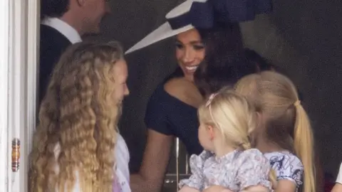 GoffPhotos Meghan Markle with Savannah Phillips and Mia Tindall in the Major General's office overlooking Trooping the Colour on Horse Guards Parade