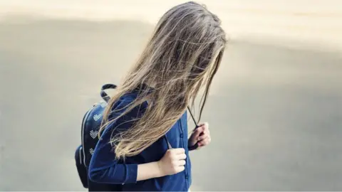 mrs Girl walking to school