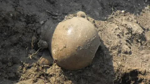 Dorset County Museum Roman vase in mud