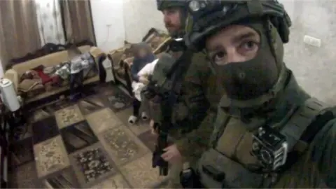 Facebook A screenshot from one of Yohai Vazana’s videos in the home of a Palestinian woman and child