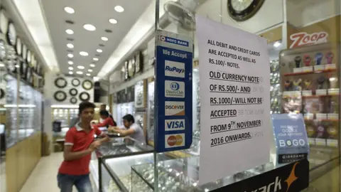 Getty Images otice stick outside the showroom after demonetization of 500 and 1000 currency notes at Chandni Chowk on November 9, 2016 in New Delhi, India.