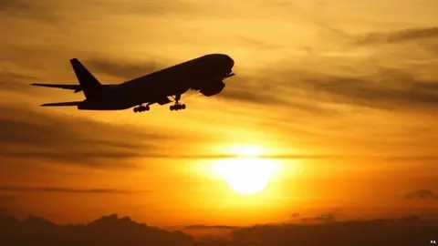 PA Plane flying into the sunset