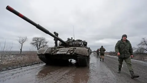 Reuters Pro-Russian fighters with a tank in Luhansk