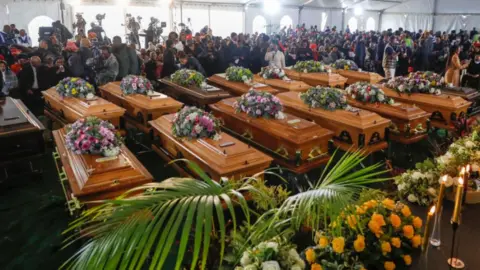 AFP Coffins in the marquee at the funeral in East London, South Africa - 6 July 2022