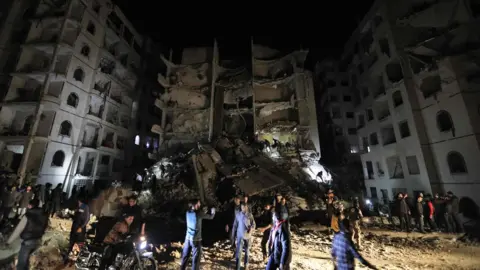 AFP A picture shows the site of an explosion of unknown origin which killed 11 civilians in Syria"s northwestern jihadist-held city of Idlib on April 9, 2018.