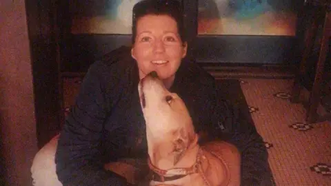 Leona Tighe Jean Tighe with a labrador dog