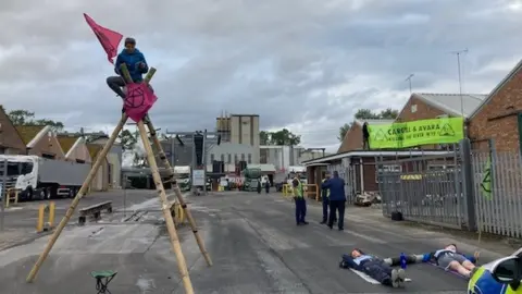 BBC Protesters with a 3m bamboo structure and banners