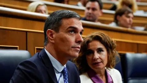 Spanish Prime Minister Pedro Sánchez and First Deputy Prime Minister María Jesús Montero attend a debate on the legislative proposal to grant amnesty to those involved in Catalonia's failed independence bid in 2017, in Madrid, Spain