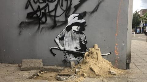 Banksy art painted over by Christopher Walken on TV show's set - BBC News