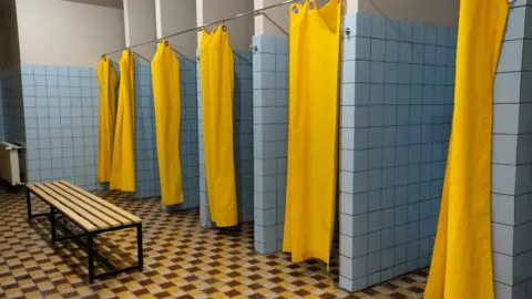 Getty Images Generic swimming pool changing room