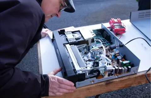 BBC Volunteers repair electrical items at the Fixing Factory in Camden, London