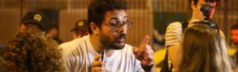 EPA A Bolsonaro supporter (left) argues with a Haddad supporter in Rio de Janeiro