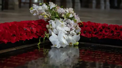 PA Media Flowers placed by Lieutenant Colonel Nana Kofi Twumasi-Ankrah, on behalf of Queen Elizabeth II