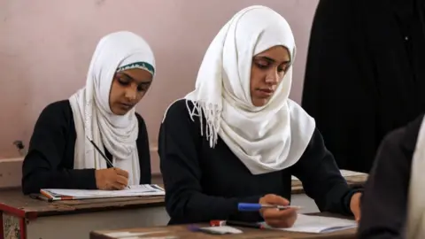 Getty Images Female Yemeni students sit at a final exam in a secondary school in Sanaa