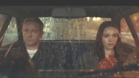 Vodafone advertisement Martin Freeman and a woman sitting in a car during the advert