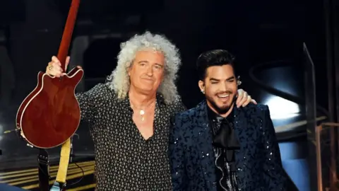 Getty Images Brian May of Queen with Adam Lambert