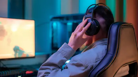 Ron Lach Esports competitor with headphones on