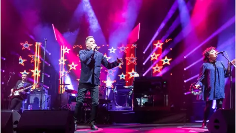 Getty Images Lewis Gordon, Ricky Ross and Lorraine McIntosh of Deacon Blue perform on stage at Usher Hall on December 08