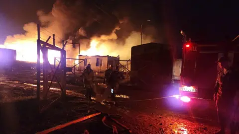 Reuters Rescue and medical personnel work following an explosion in the gas warehouse near the Stepanakert-Askera highway in Berkadzor on 25 September