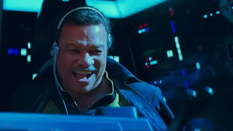 Lucasfilm Lando Calrissian piloting the Millennium Falcon