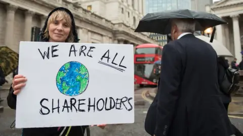 Getty Images Extinction Rebellion protestor outside of the Bank of England in 2019.