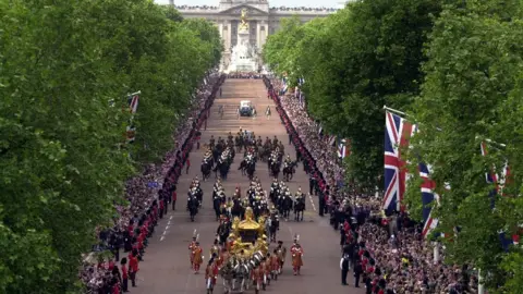 PA Media The Queen's golden coach in procession from Buckingham Palace