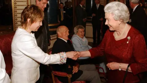 PA Media The Queen with Jayne Torvill