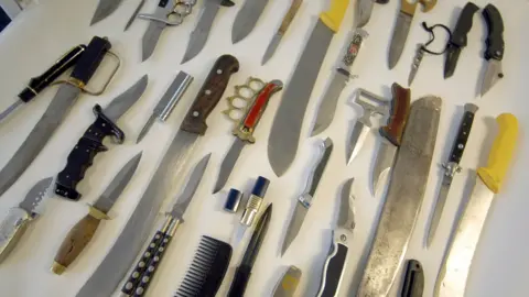 Knives and blades lie on a table