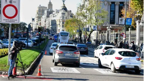 Javier Soriano/Getty Images Cars pass signs reading "Madrid Central" in the Spanish capital, 30 November 2018