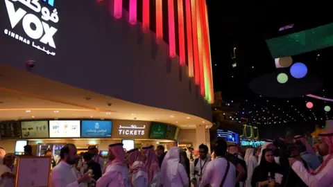 Getty Images Saudis gather at a cinema theatre in Riyadh Park mall