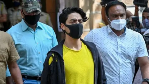 Getty Images Aryan Khan leaves after his weekly attendance at the Narcotics Control Bureau (NCB) office in Mumbai on November 12, 2021, after he was released on bail in connection with a drug case