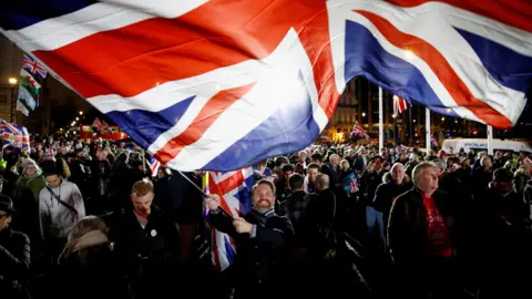 Reuters Man waving Union Jack on 31 January 2020, the day the UK left the EU