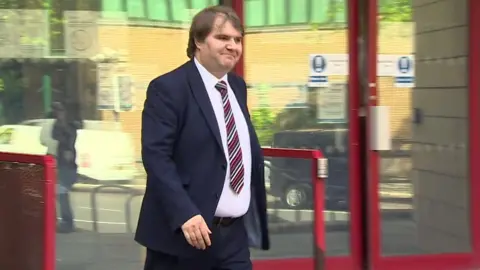 Jamie Wallis leaving court