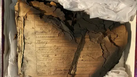 Norfolk Museums Service Charred remains of church records