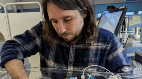Robert Miller and Katie Fowler Robert Miller holding Abigail's hand in hospital