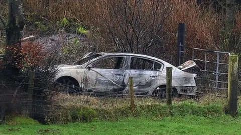 Pacemaker Suspected getaway car in 2013 murder of Irish police officer Adrian Donohoe was found burned out in Northern Ireland