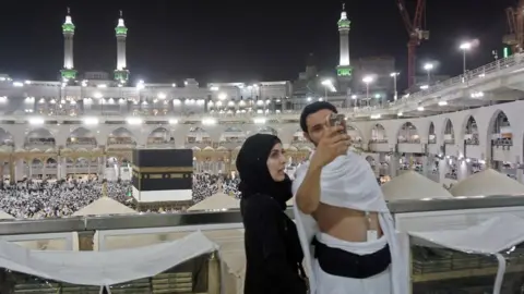 AFP Muslim pilgrims take a selfie inside Mecca's Grand Mosque at the start of the Hajj (30 August 2017)