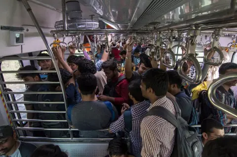 Getty Images People travel in Central Railway's first air-conditioned EMU local train, on January 30, 2020, in Mumbai, India.