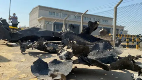 Reuters Debris seen in front of Saudi Aramco oil facility in Jeddah that the Houthis said they attacked (24 November 2020)