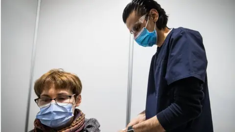 Getty Images A woman receives AstraZeneca vaccine in Melbourne