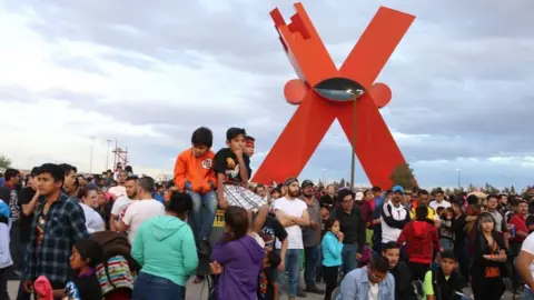 Ciudad Juarez/X Children wearing Dragon Ball t-shirts are among a large crowd gathered for a screening of the anime