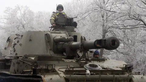AFP A Ukrainian soldiers sits atop a self-propelled howitzer. File photo
