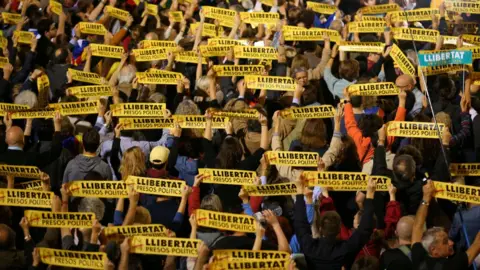 Reuters People hold banners reading "Freedom Political Prisoners" during a gathering in support of the members of the dismissed Catalan cabinet after a Spanish judge ordered the former Catalan leaders to be remanded in custody pending an investigation into Catalonia"s independence push, outside Barcelona"s town hall, Spain, November 3, 2017