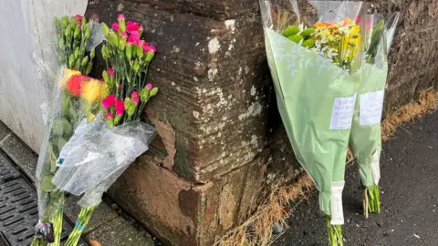 Flowers laid at Castle Place, New Cumnock