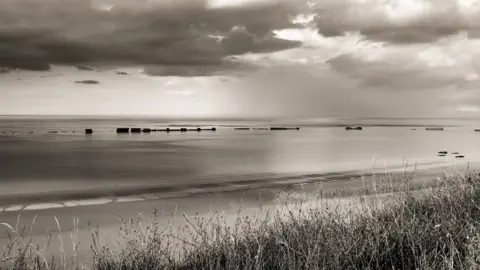 Getty Images The remains of the D-Day 'Mulberry' artificial harbour at Arromanches, Normandy